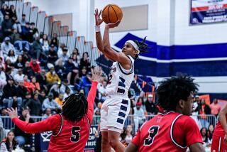 Myles Walker of Eastvale Roosevelt puts up a shot against Harvard-Westlake.