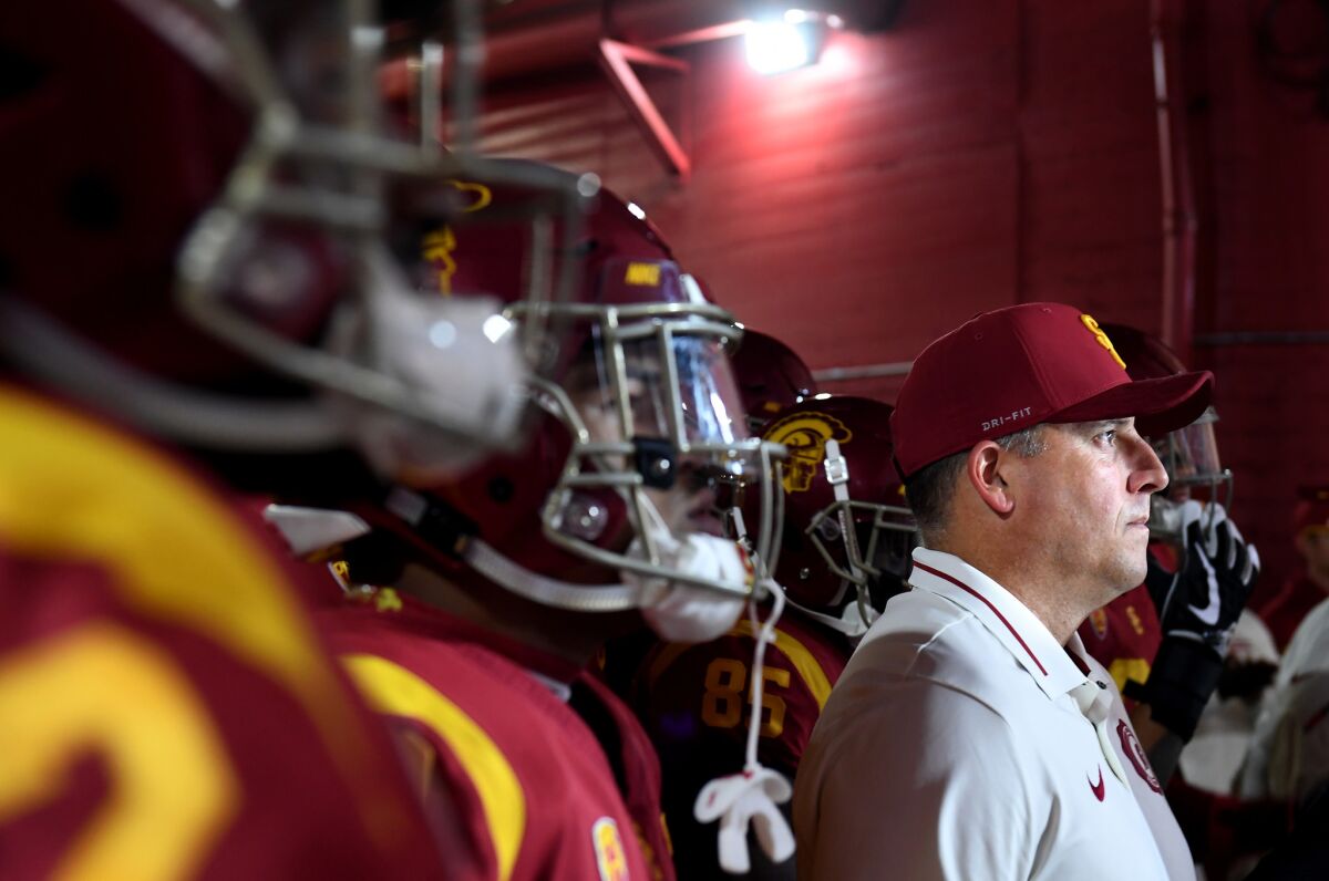 USC head coach Clay Helton prepares to take his team on to the field against Notre Dame at the Coliseum on Nov. 24, 2018.