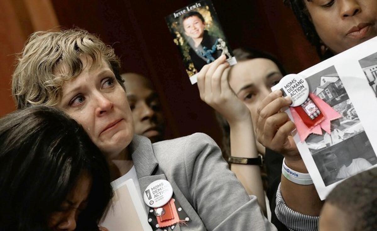 On the nine-month anniversary of the mass shooting at Sandy Hook Elementary School in Connecticut, members of Moms Demand Action attend a news conference at the U.S. Capitol to call for gun reform legislation.