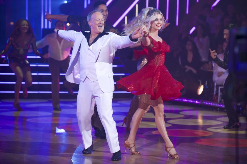 This Sept. 30, 2019 photo released by ABC shows former White House press secretary, Sean Spicer, left, and Lindsay Arnold during the celebrity dance competition series "Dancing With the Stars," in Los Angeles. President Donald Trump tweeted Monday, Oct. 14, that viewers should vote for Spicer. The president called hima “good guy” and wrote “he has always been there for us!” Spicer told USA Today there’s no question a “huge” amount of his votes come from Trump supporters. (Eric McCandless/ABC via AP)