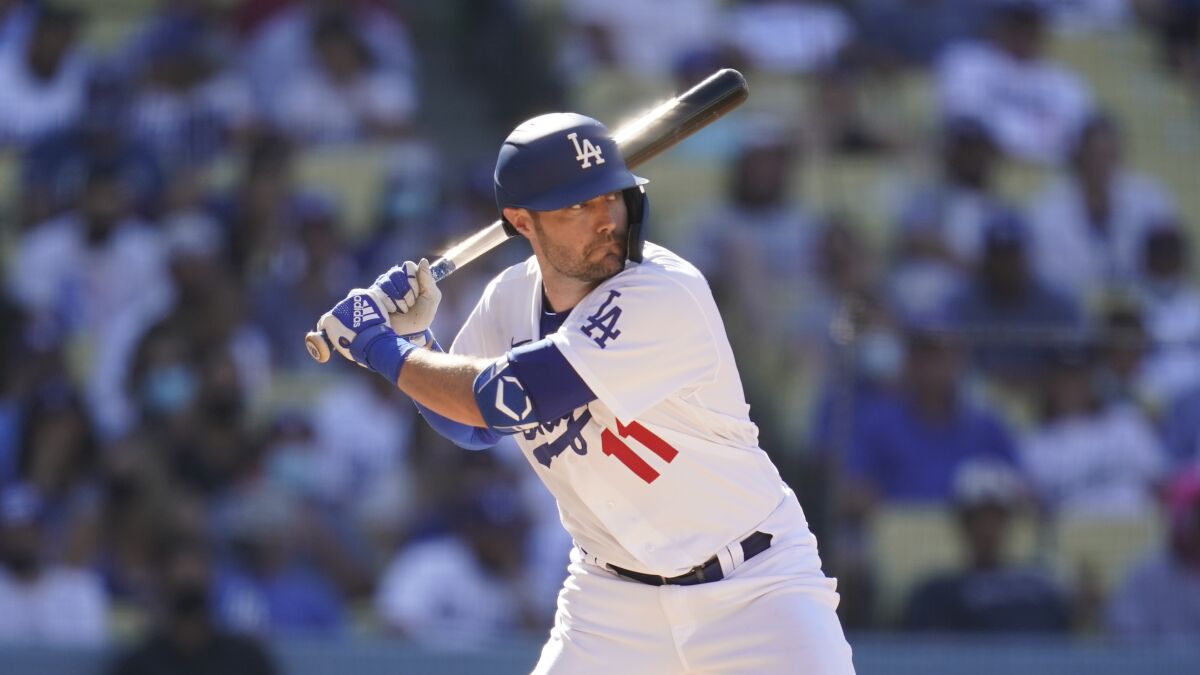 Los Angeles Dodgers' AJ Pollock bats during a baseball game against the Colorado Rockies.