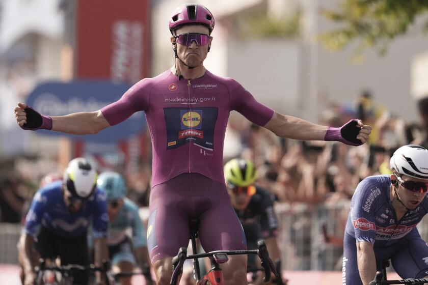 Italy's Jonathan Milan celebrates winning the 11th stage of the Giro d'Italia, Tour of Italy cycling race, from Foiano di Val Fortore to Francavilla al Mare, Italy, Wednesday, May 15, 2024. (Massimo Paolone/LaPresse via AP)