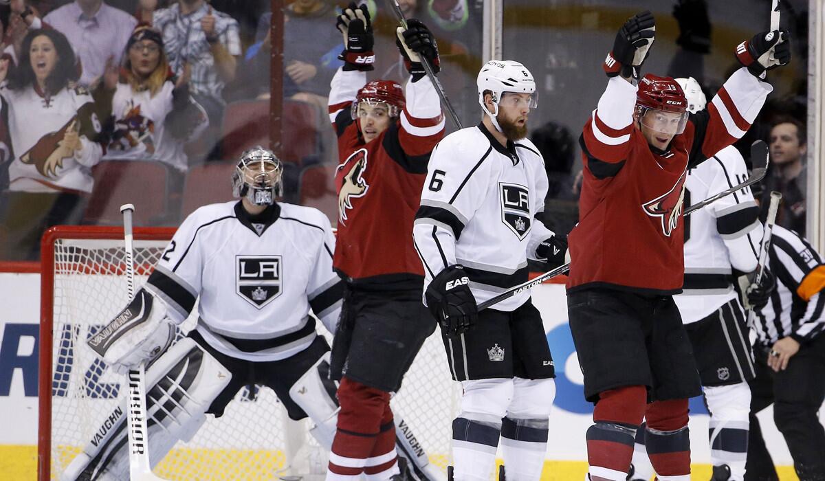 Arizona Coyotes' Shane Doan, right, celebrates his goal with teammate Antoine Vermette as Kings goalie Jonathan Quick and Jake Muzzin (6) look on during the first period on Jan. 23.