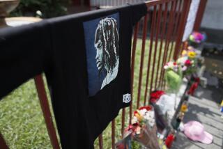 Los Angeles, CA, Tuesday, September 13, 2022 - A growing memorial in the parking lot at Roscoe's House of Chicken and Waffles where rapper PnB Rock was shot and killed while being robbed inside the restaurant. (Robert Gauthier/Los Angeles Times)