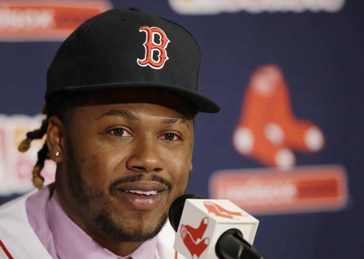 Hanley Ramirez responds to a reporters' questions after being introduced to the media Nov. 25 at Boston's Fenway Park.