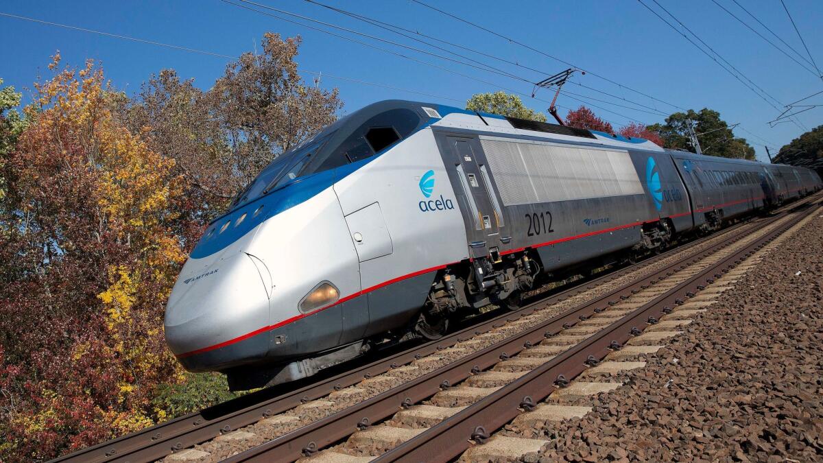 An Amtrak Acela train travels through Old Lyme, Conn. on Oct. 18. Last year the Federal Railroad Administration granted a Buy American Act waiver to Amtrak so it could buy 28 multi-car trains from France-based Alstom.