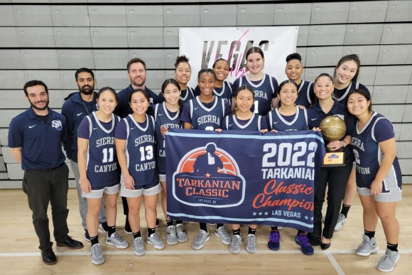 Sierra Canyon's unbeaten girls' basketball team celebrates winning its division of the Tarkanian Classic.