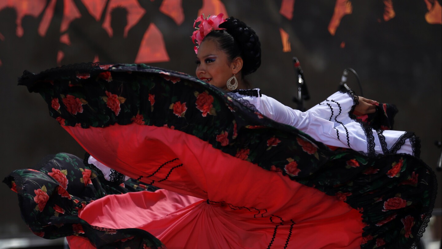 A folklorico dancer on stage during the 26th annual Fiesta Broadway in Los Angeles on Sunday.