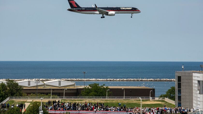 Donald Trump's plane flies over a campaign rally at the Great Lakes Science Center in Cleveland during the 2016 Republican National Convention. He is thinking about appointing the pilot of his private plane to run the Federal Aviation Administration.