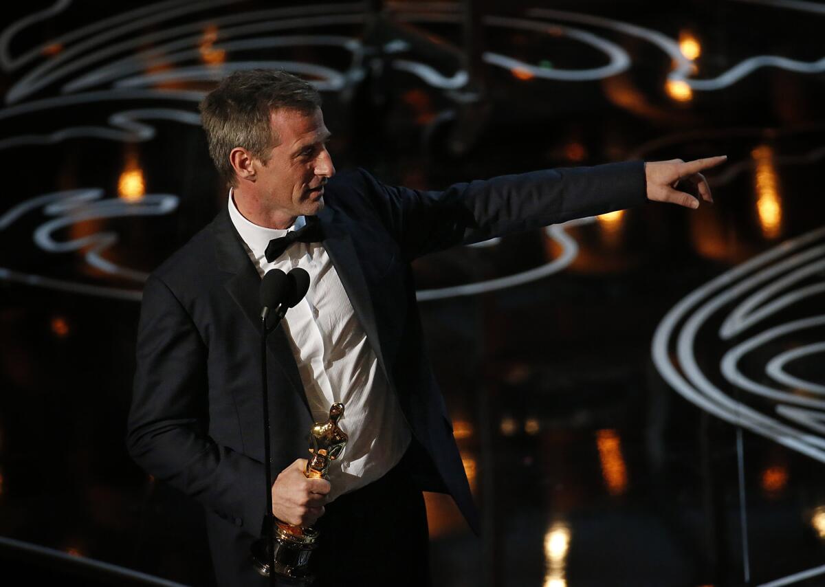 Spike Jonze accepts the Oscar for best original screenplay at the 2014 Academy Awards.