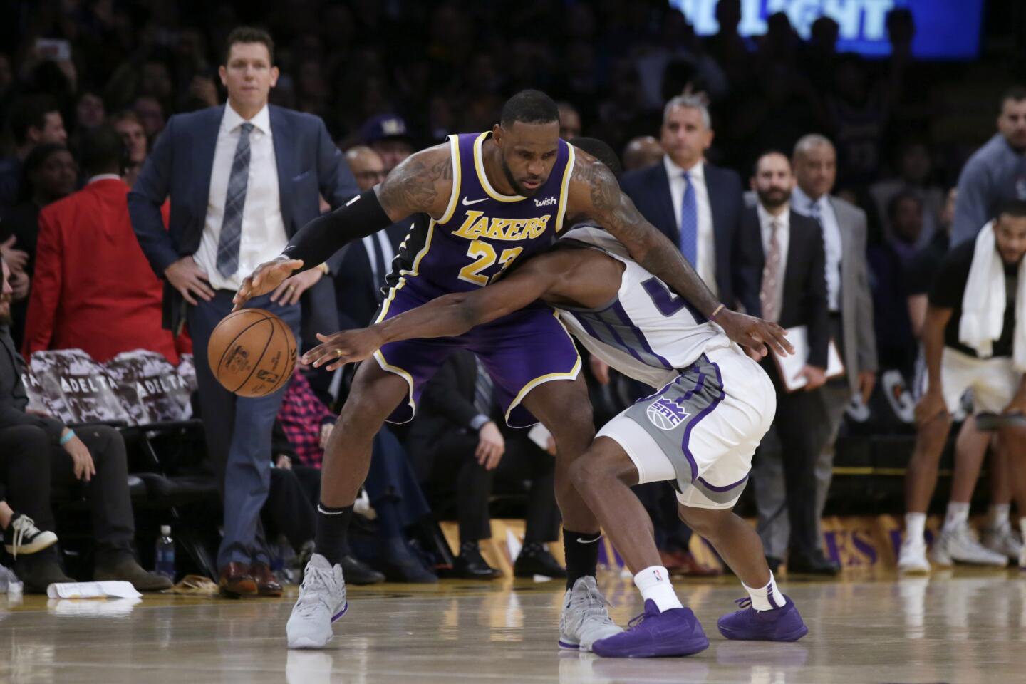 Sacramento Kings forward Harrison Barnes, right, fouls Lakers forward LeBron James