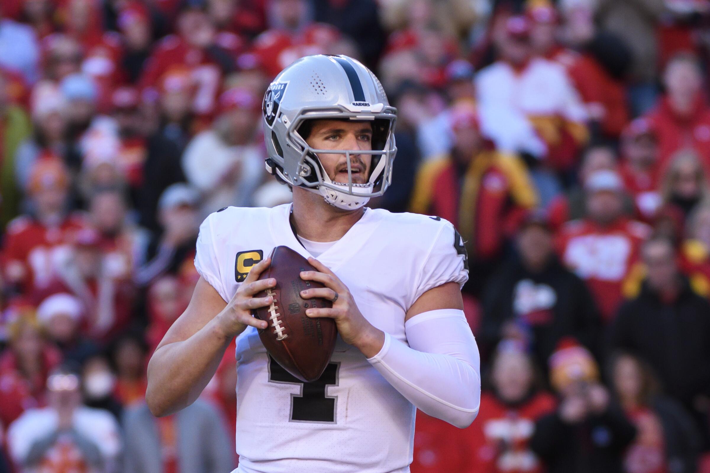 Las Vegas Raiders quarterback Derek Carr looks to throw against the Kansas City Chiefs.