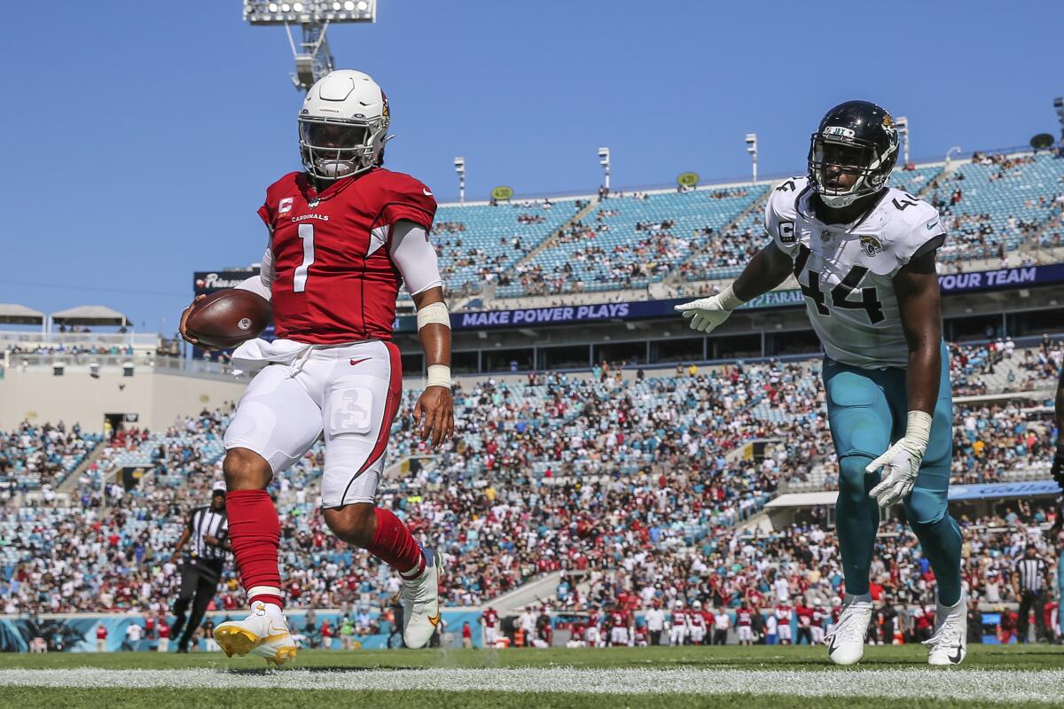 Arizona Cardinals quarterback Kyler Murray is chased out of bounds by Jacksonville Jaguars linebacker Myles Jack.