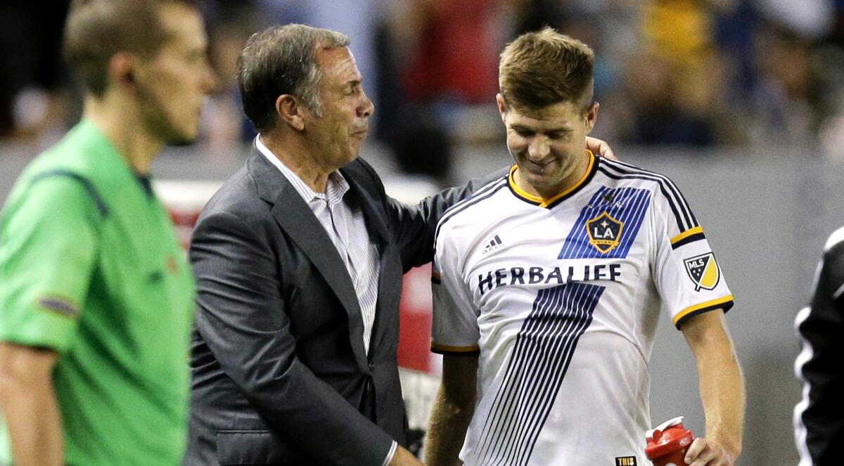 Galaxy Coach and General Manager Bruce Arena, center, has maneuvered through MLS' ever-evolving salary guidelines to bring in top-tier talent like former Liverpool captain Steven Gerrard.