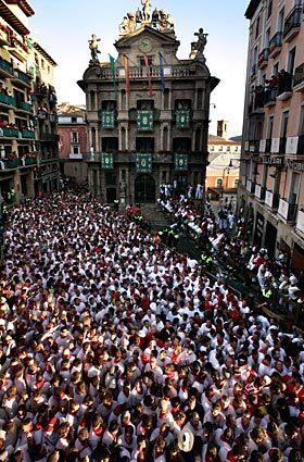 Thousands of revelers await the start of the running of the bulls during the Fiesta de San Fermin in Pamplona, Spain, on Monday. The festival, held since 1591, attracts tens of thousands of foreign visitors each year for nine days of revelry, morning bull runs and afternoon bullfights.