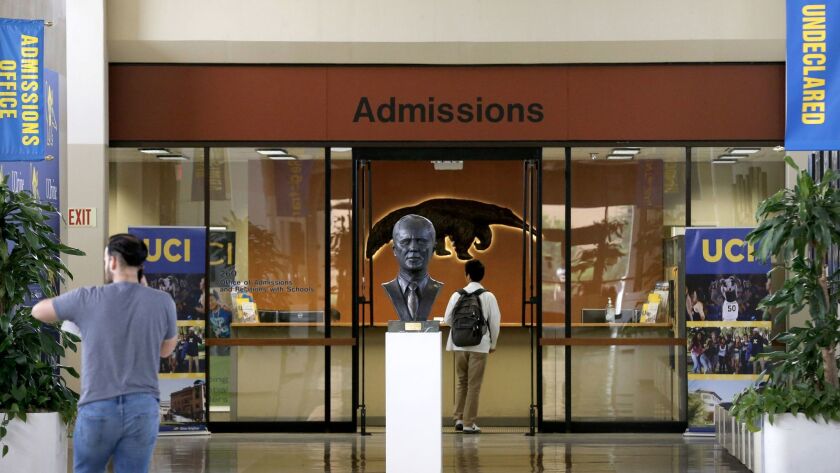 Students visit the Office of Admissions in Aldrich Hall at UC Irvine, which sparked an uproar after it rescinded nearly 500 admission offers two months before the start of fall term. The campus announced last week it will reinstate most students.