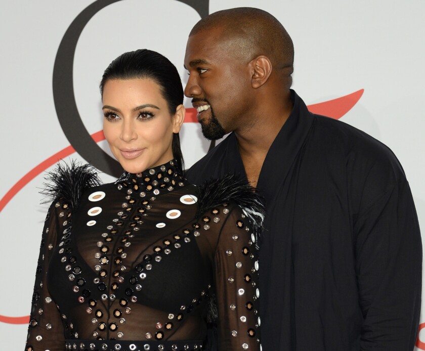 Kim Kardashian and Kanye West arrive at the CFDA Fashion Awards in New York in June 2015.