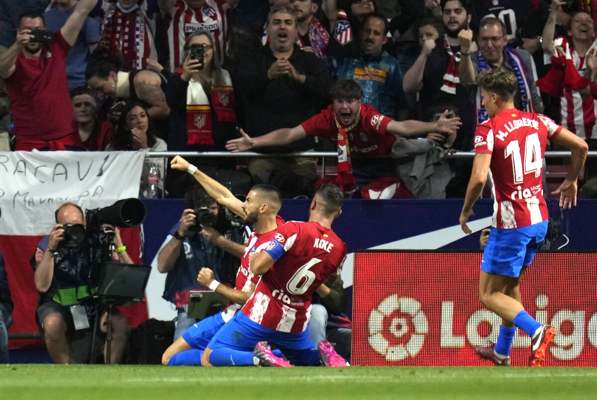 Atletico Madrid's Yannick Carrasco celebrates after scoring his side's opening goal during a Spanish La Liga soccer match between Atletico Madrid and Real Madrid at the Wanda Metropolitano stadium in Madrid, Spain, Sunday, May 8, 2022. (AP Photo/Manu Fernandez)