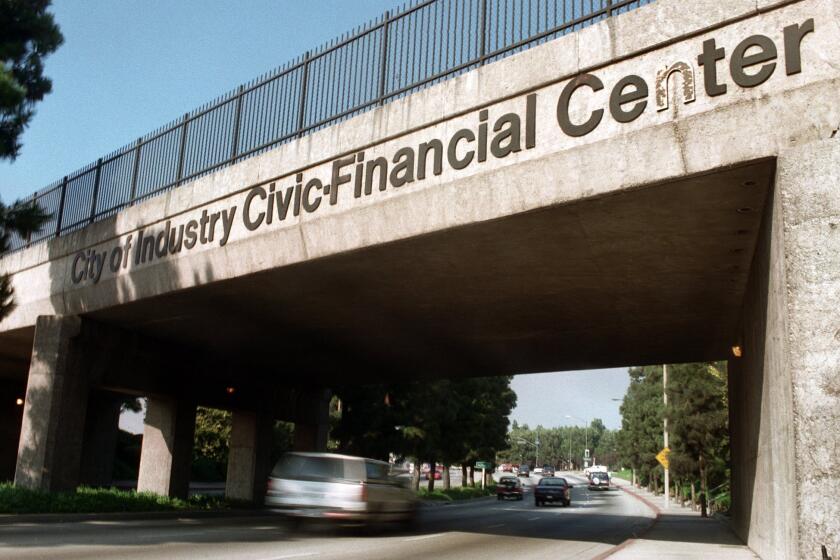 An audit finds that former City of Industry Mayor Dave Perez and his relatives financially benefited from city contracts. Above, one of the larger signs identifying the city on Hacienda Boulevard.