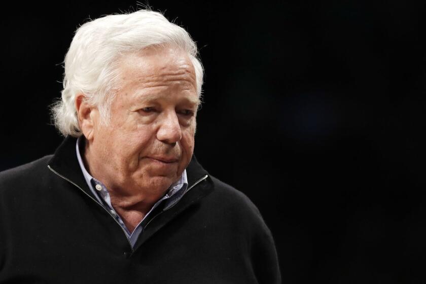 New England Patriots owner Robert Kraft leaves his seat during an NBA basketball game between the Brooklyn Nets and the Miami Heat, Wednesday, April 10, 2019, in New York. (AP Photo/Kathy Willens)