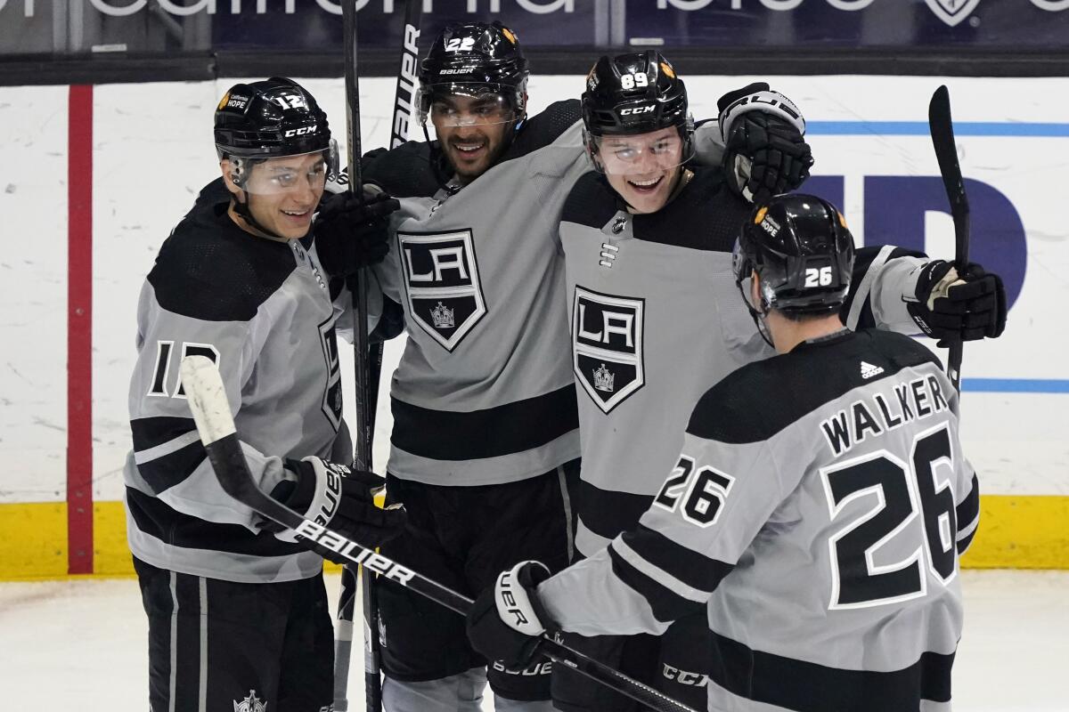 The Kings' Rasmus Kupari, second from right, celebrates his first career goal with teammates May 8, 2021.