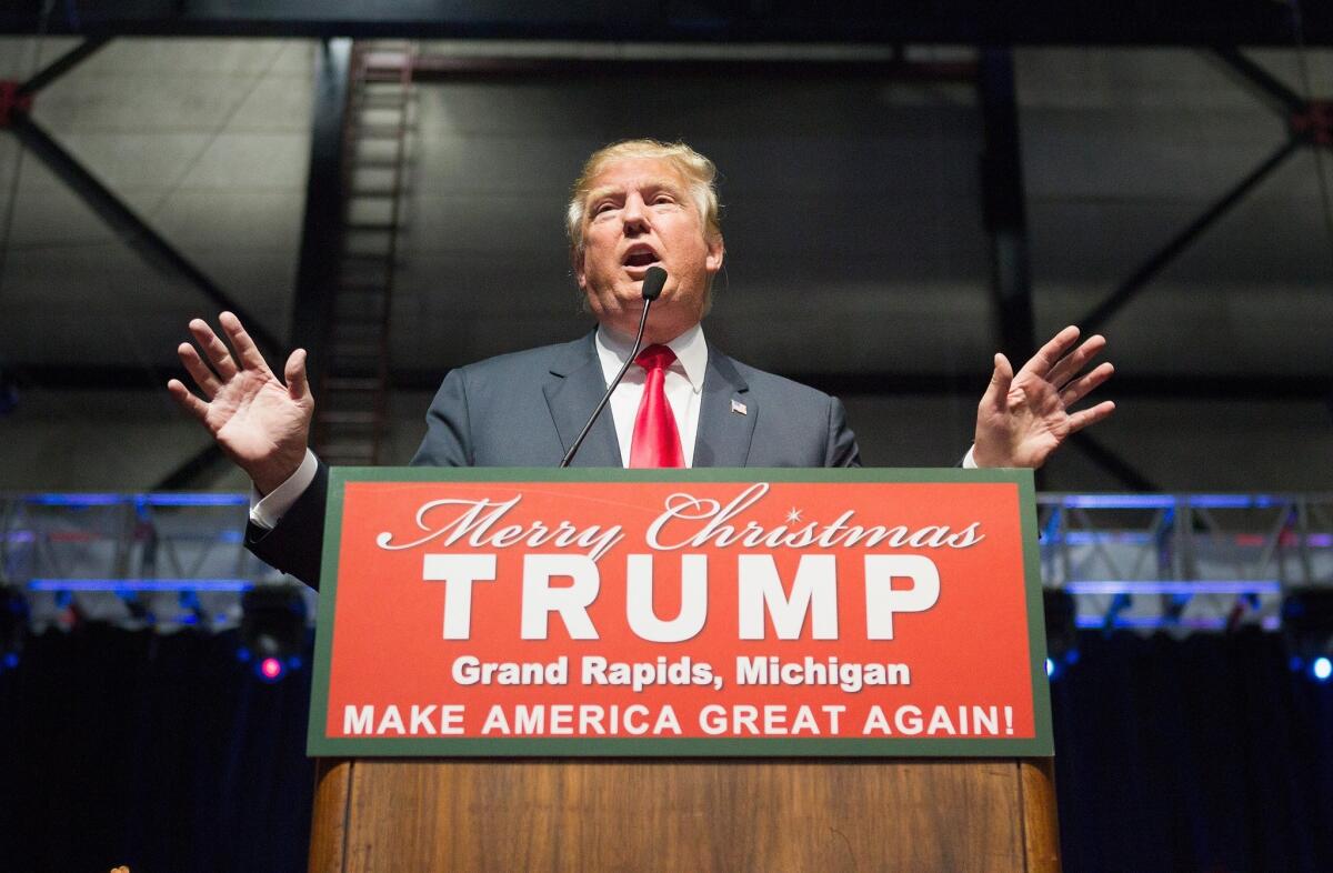Republican presidential candidate Donald Trump speaks to guests at a campaign event on Dec. 21 in Grand Rapids, Mich.