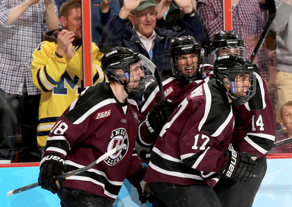 Union's Daniel Ciampini (17) celebrates with teammates after scoring a goal in the first period agianst Minnesota in the NCAA championship game.
