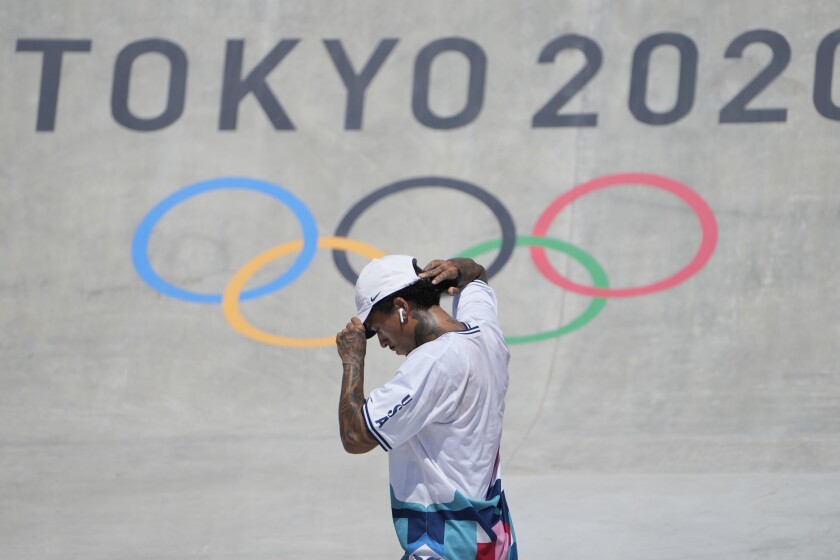 Nyjah Huston picks himself up after failing to complete a trick in the Olympic street skateboarding competition Sunday.
