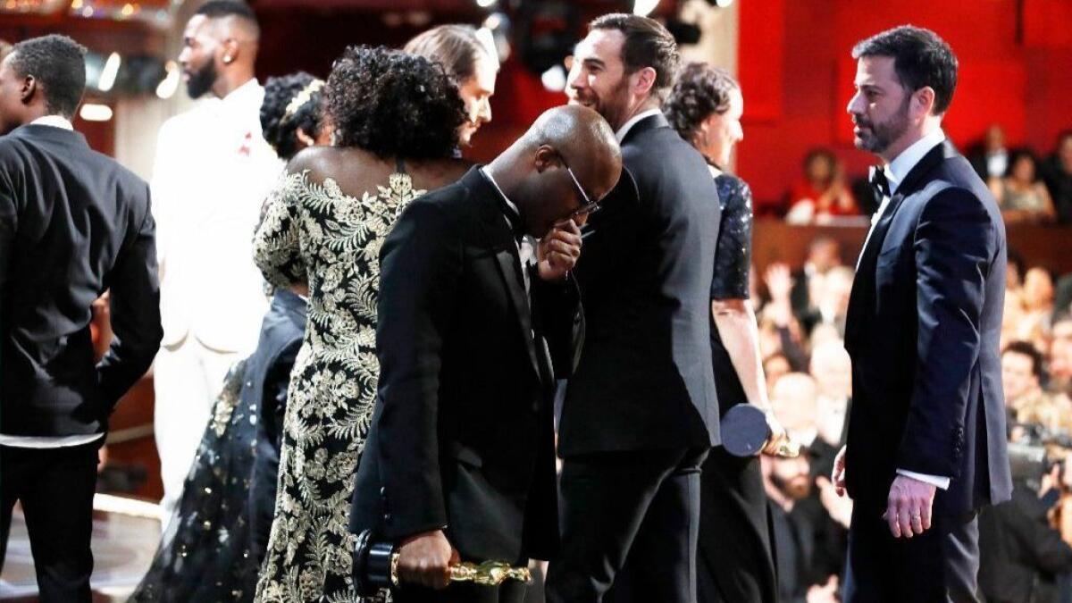 "Moonlight" writer-director Barry Jenkins, seen from backstage, is stunned after winning Best Picture at the 2017 Oscars.