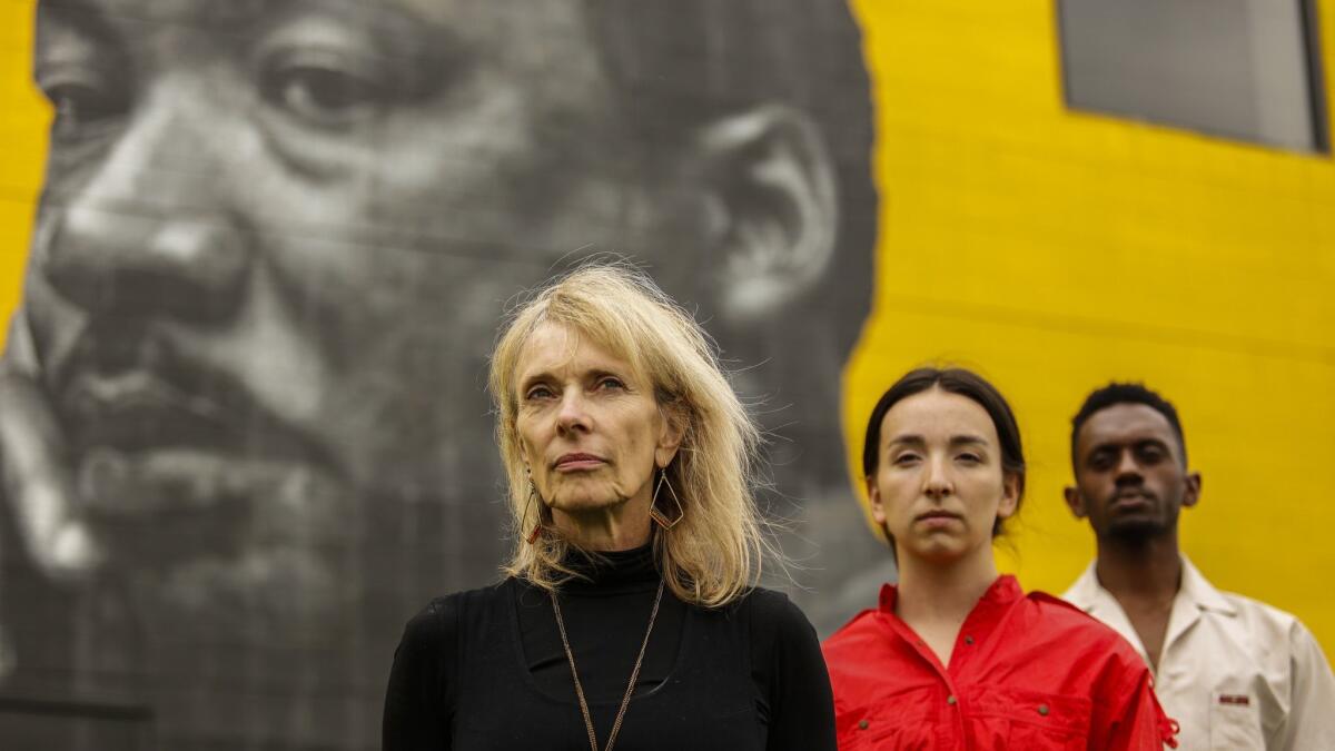 In front of Lynwood's Martin Luther King Jr. mural, from left, Heidi Duckler with her dance company's Lily Ontiveros and Raymond Ejiofor.