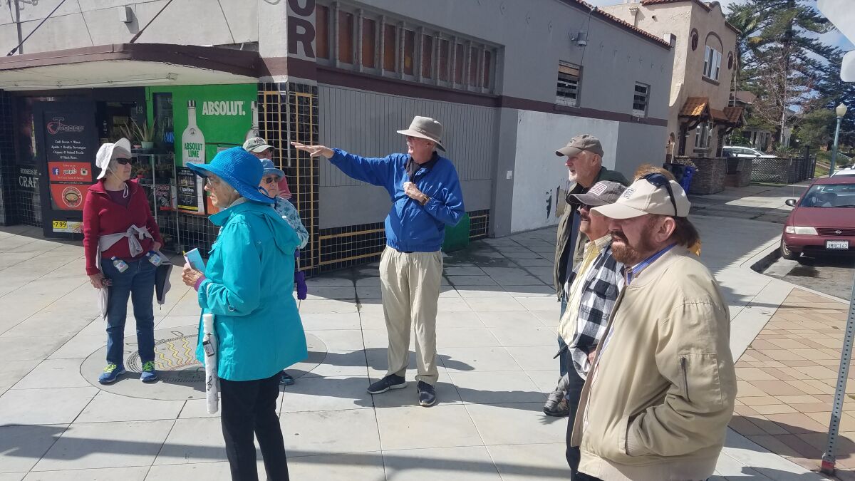 Dan Haslam (center) shares historical information during a March 4 walking tour of Golden Hill.