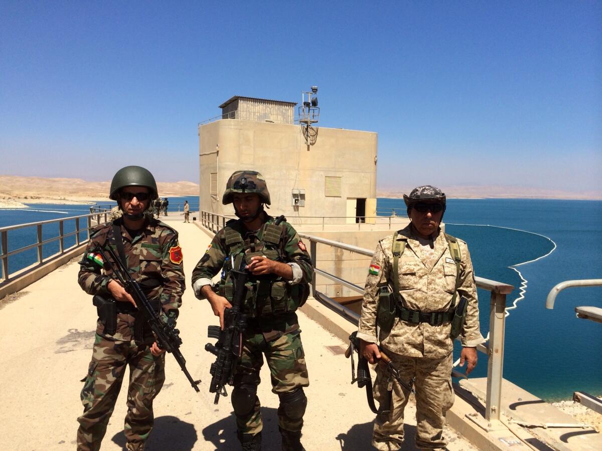 Kurdish peshmerga soldiers guard the power station at the Mosul dam on Thursday.