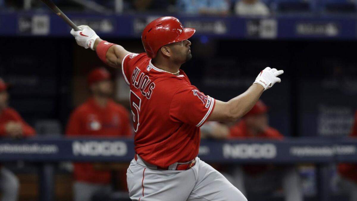 Angels slugger Albert Pujols hits a two-run home run against the Tampa Bay Rays on June 13.