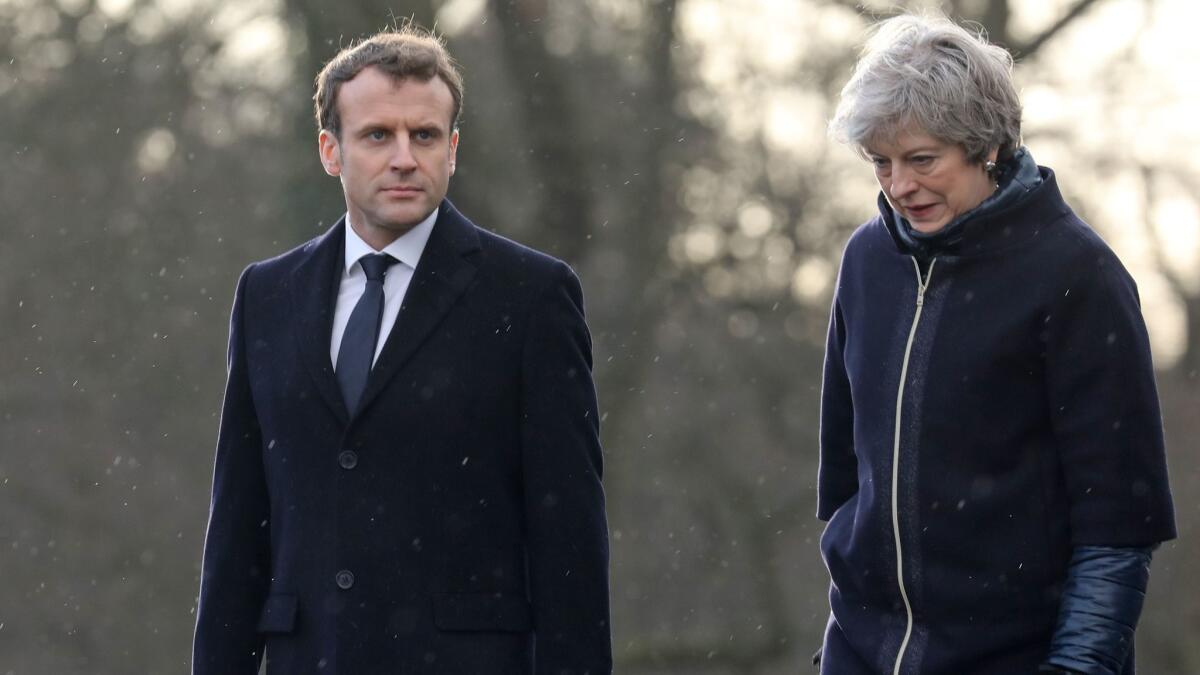 French President Emmanuel Macron and British Prime Minister Theresa May attend a ceremony at the Royal Military Academy Sandhurst, west of London on Thursday.