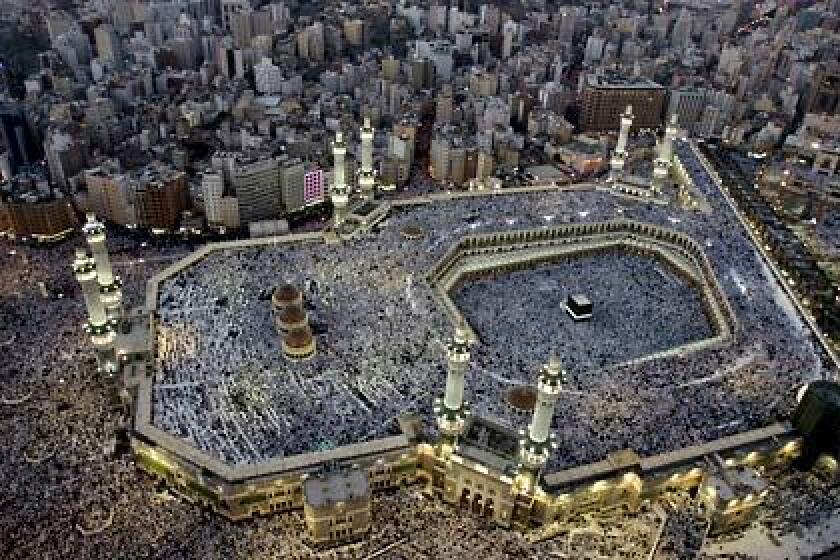 Pilgrims from all over the world fill the three levels of Mecca's Grand Mosque for prayers at sunset in the days before the hajj. The black cube-shaped building in the mosque is the Kaaba, built by the prophet Abraham.