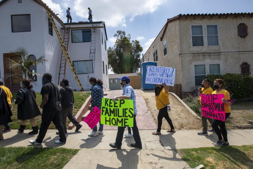 LOS ANGELES, CA - MAY 18: Tenants and housing rights advocates march with Jenise Dixon, who is being harassed by her landlord, to her Picfair Village neighborhood apartment on Tuesday, May 18, 2021 in Los Angeles, CA. (Brian van der Brug / Los Angeles Times)