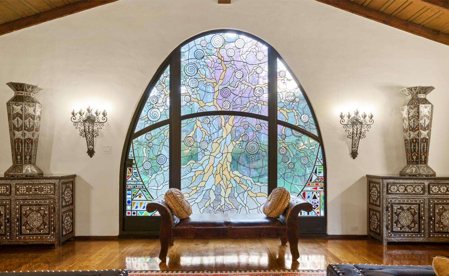 Built in 1928, the Spanish-style hacienda includes a massive custom stained-glass window called "Tree of Life."