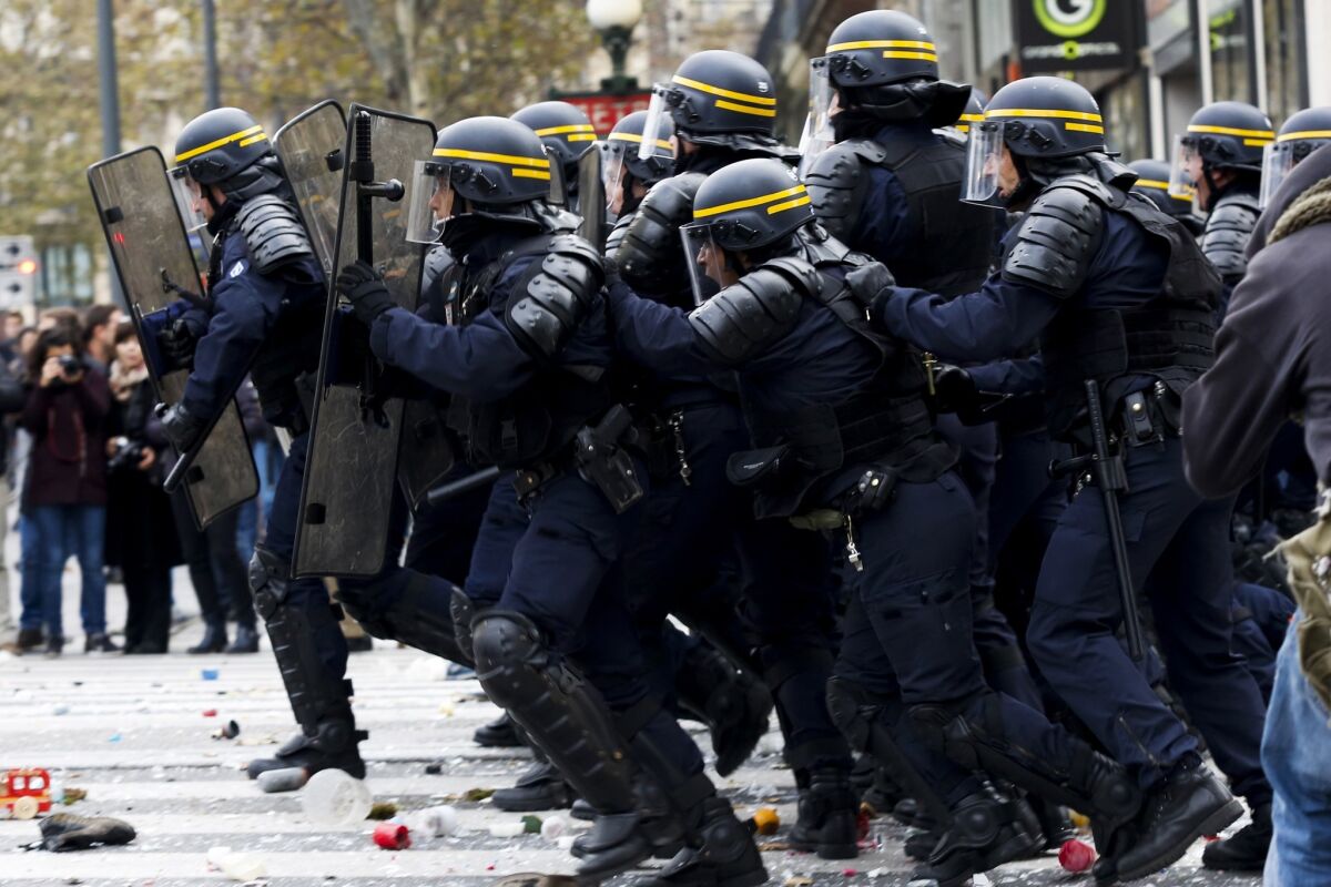 Protesters clash with riot police in Paris on Nov. 29 during a rally that demanded action on climate change.