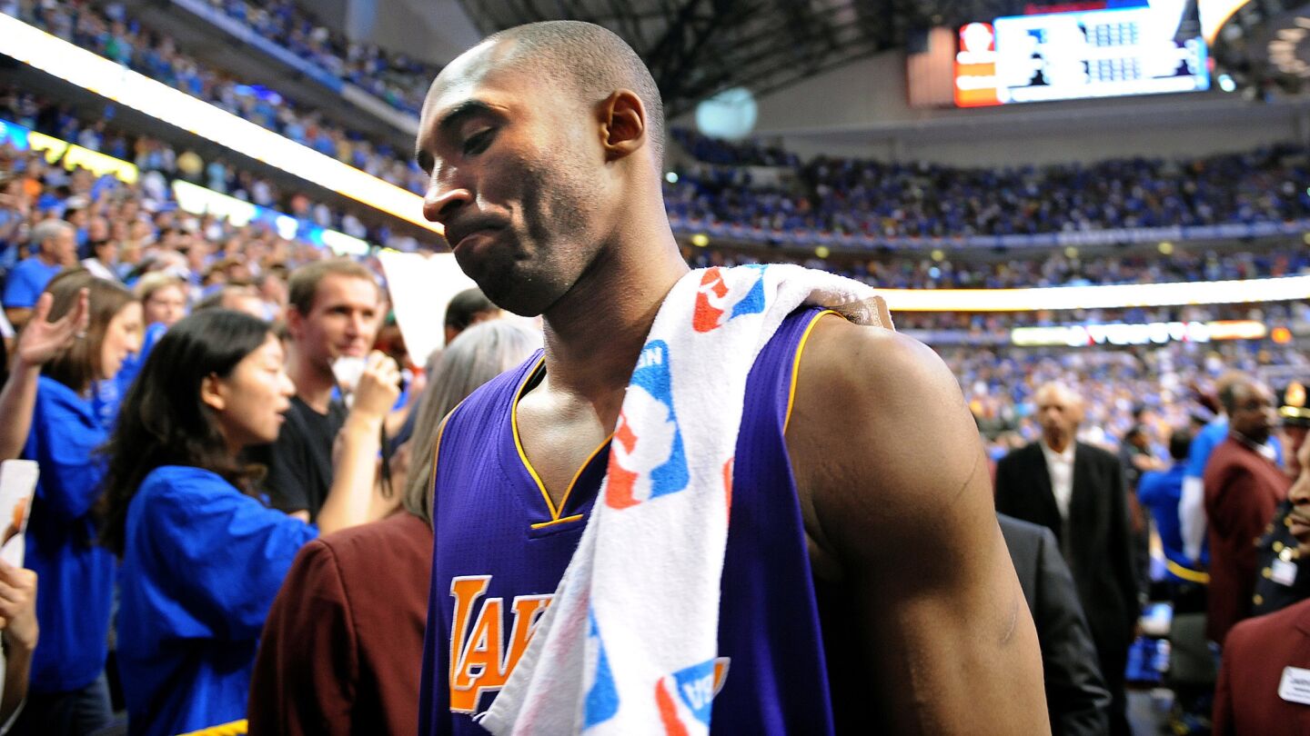 Lakers star Kobe Bryant walks off the court after the team's season-ending loss to the Dallas Mavericks in Game 4 of the Western Conference semifinals on May 8, 2011.