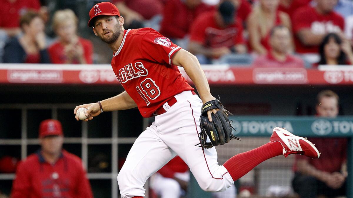 Angels third baseman Kyle Kubitza fields a bunt but doesn't have time to make the throw to first base to get the runner during a game against the Diamondbacks on June 16.