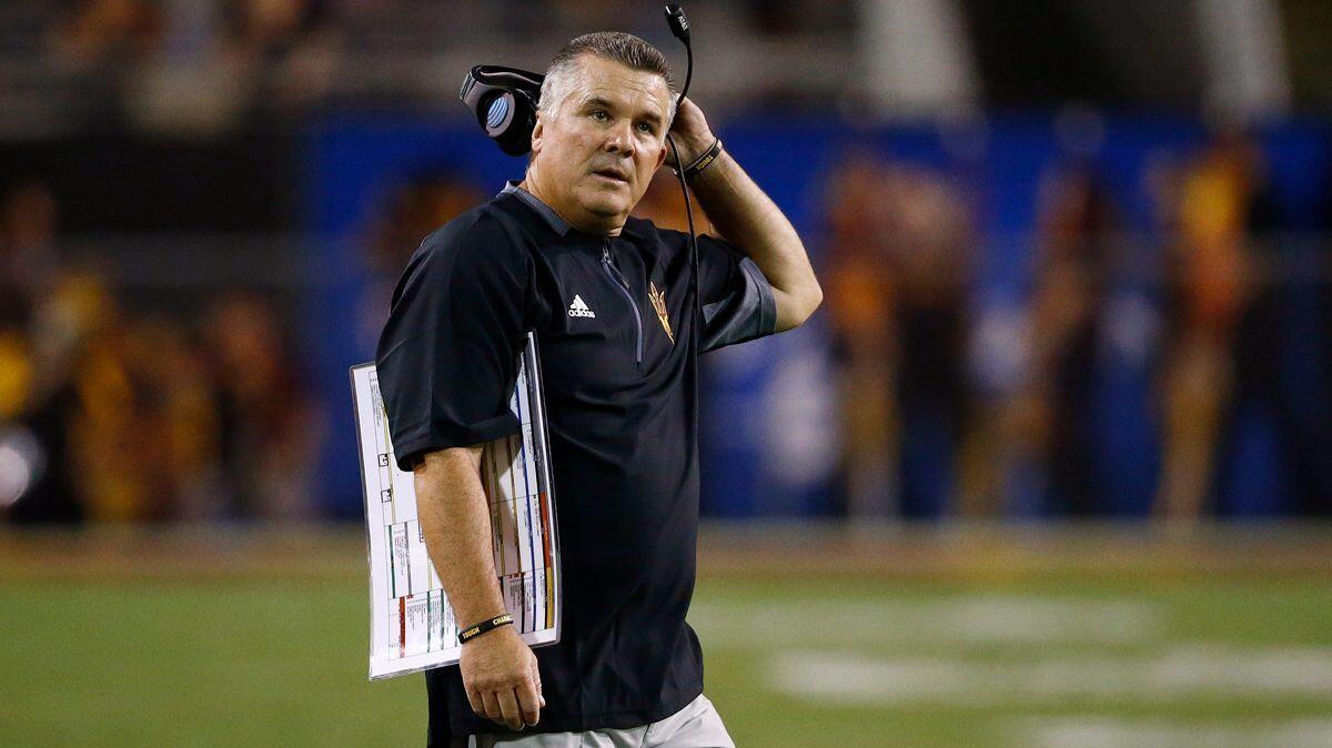 Former Arizona State coach Todd Graham stands on the field during the first half against San Diego State on Sept. 9. Arizona State paid Todd Graham $12.1 million to leave