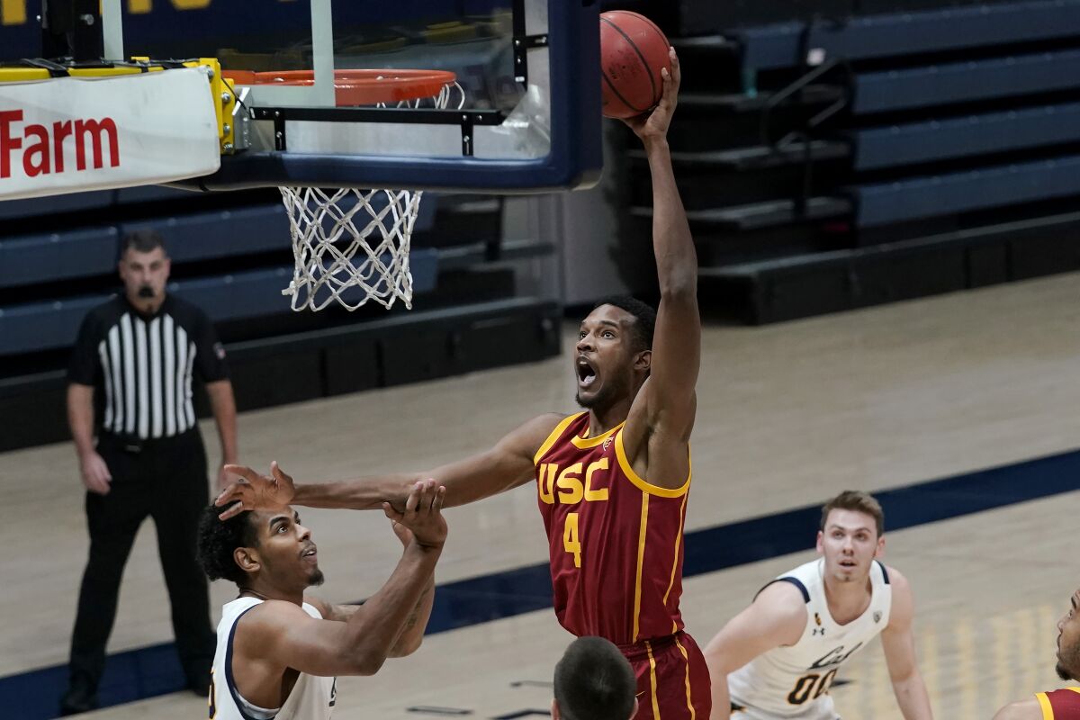 USC's Evan Mobley goes up for a shot over California's Andre Kelly, left, during the first half Jan. 23, 2021.
