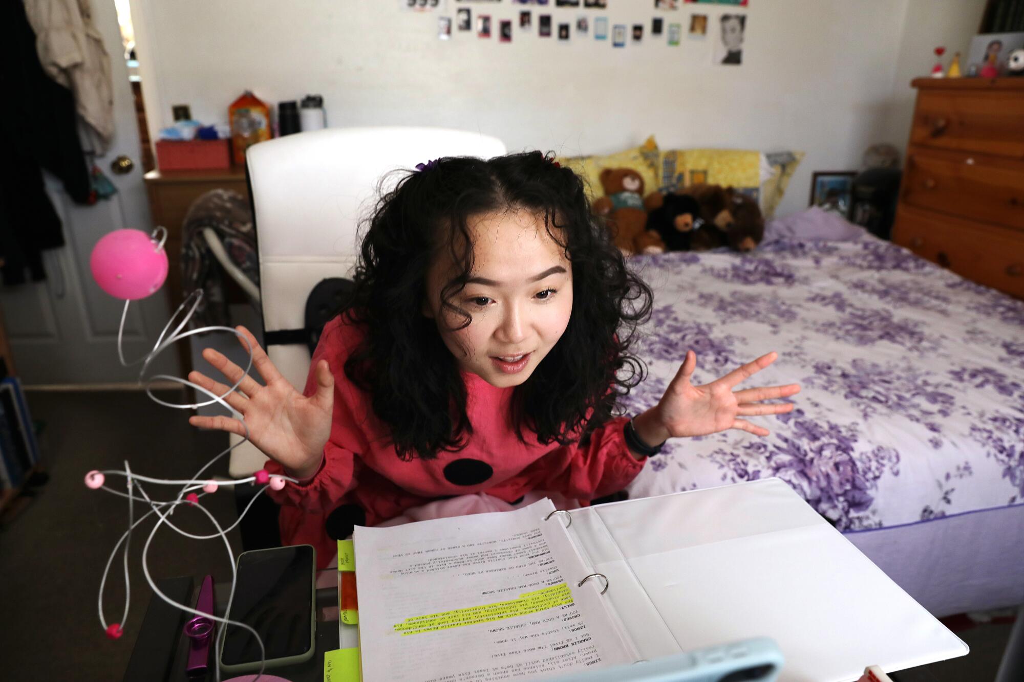 Emily Chen rehearses for a school play at home.