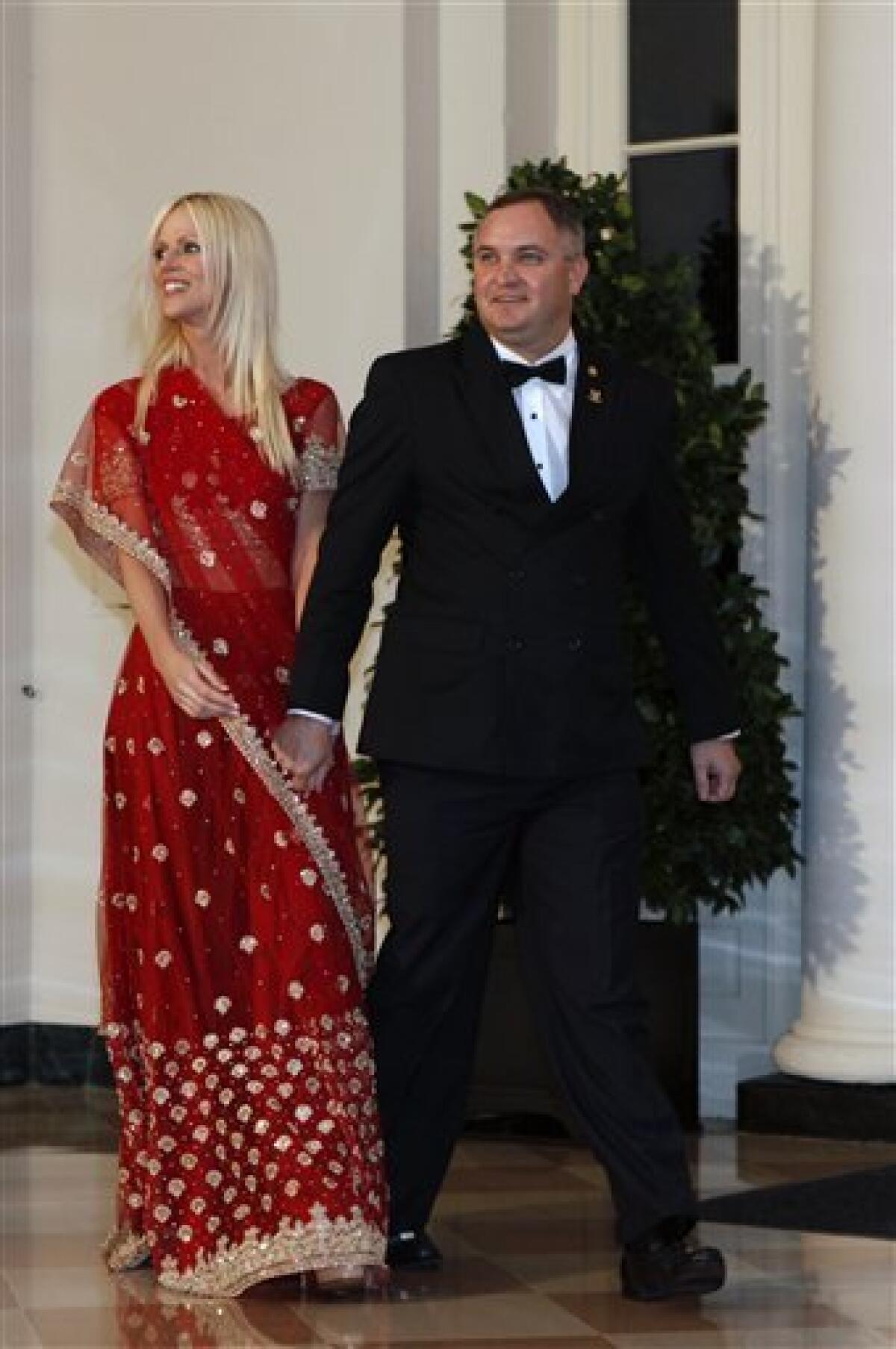 In this Tuesday, Nov. 24, 2009 photo, Michaele and Tareq Salahi, right, arrive at a State Dinner hosted by President Barack Obama for Indian Prime Minister Manmohan Singh at the White House in Washington. The Secret Service is looking into its own security procedures after determining that the Virginia couple managed to slip into Tuesday night's state dinner at the White House even though they were not on the guest list, agency spokesman Ed Donovan said. (AP Photo/Gerald Herbert)