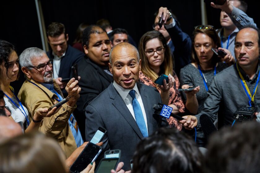 LONG BEACH, CALIF. - NOVEMBER 16: Presidential candidate and former Massachusetts governor Deval Patrick, surrounded by members of the media, speaks in the spin room, during the 2019 California Democratic Party Fall Endorsing Convention at the Long Beach Convention Center on Saturday, Nov. 16, 2019 in Long Beach, Calif. (Kent Nishimura / Los Angeles Times)