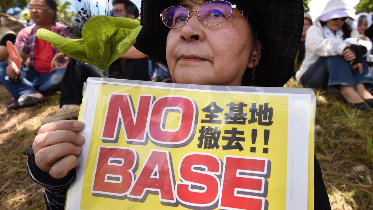 A demonstrator takes part in a rally against the U.S. military presence in Naha in Japan's Okinawa prefecture on June 19, 2016.
