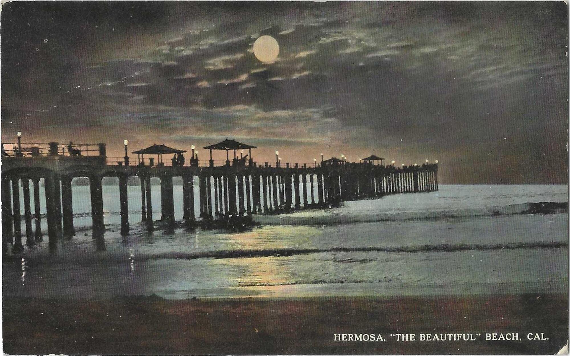An old postcard showing a pier, with moonlight reflecting off a glassy sea.