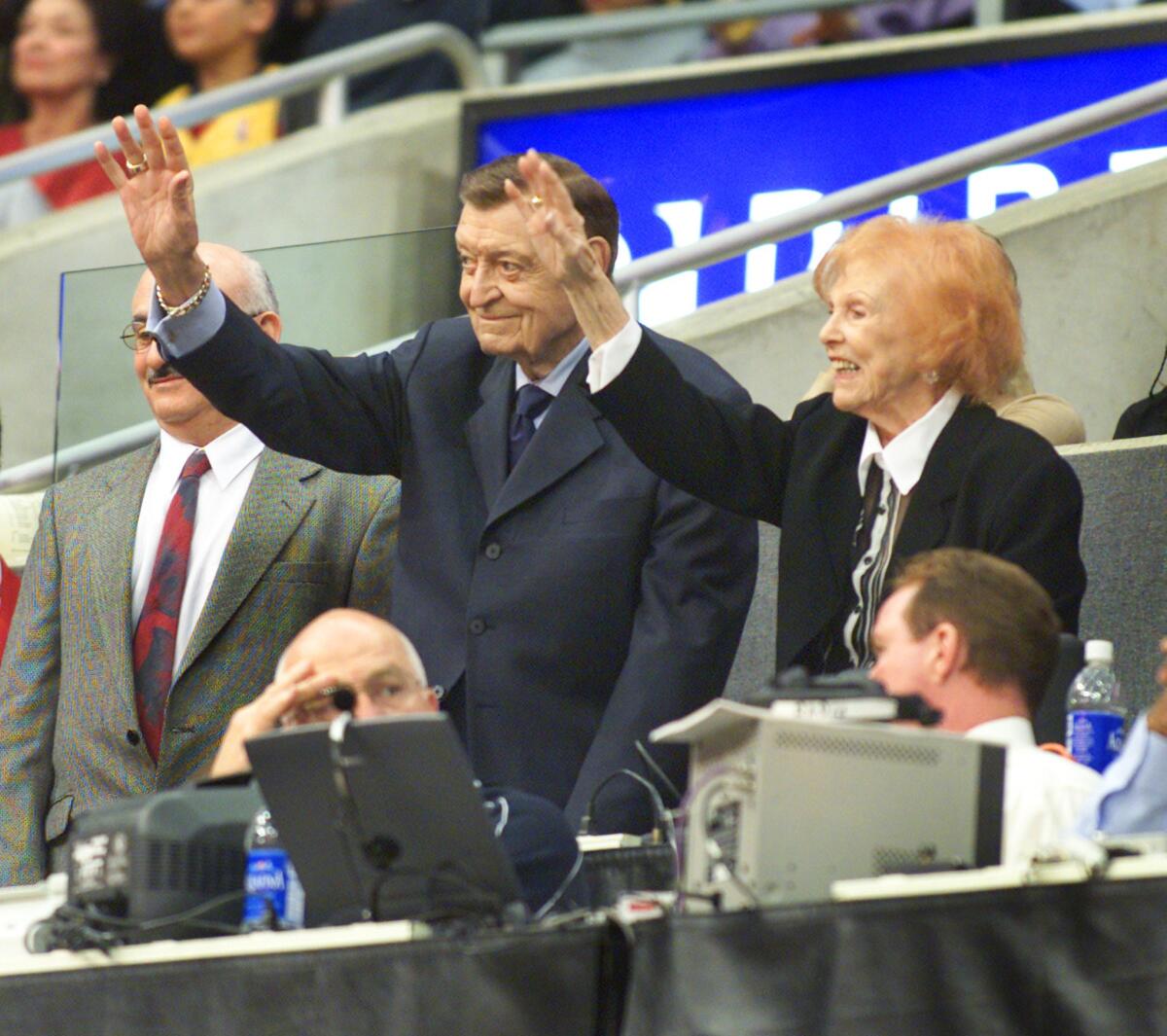 Lakers announcer Chick Hearn and his wife, Marge, at Staples Center in 2002.