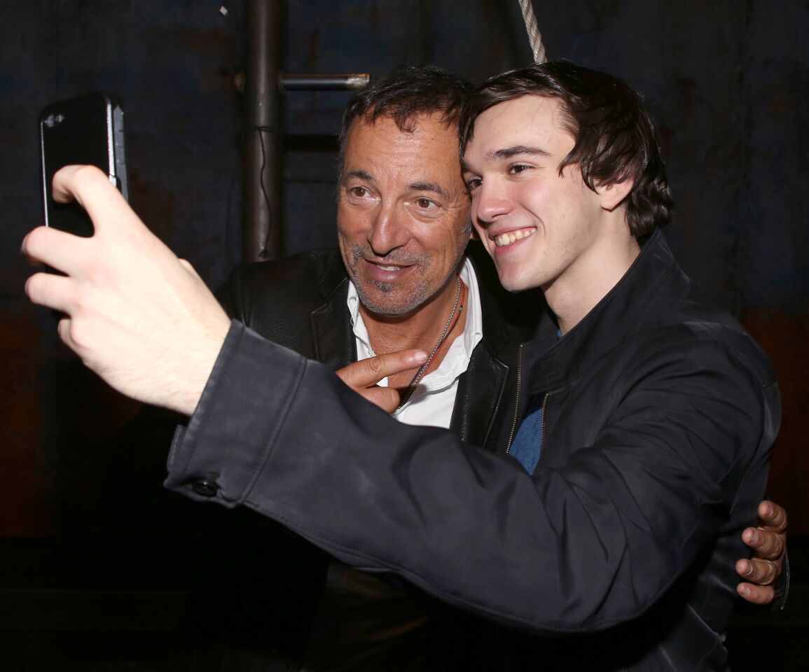 Collin Kelly-Sordelet with Bruce Springsteen backstage after a performance of "The Last Ship" at the Neil Simon Theatre on Oct. 15, 2014, in New York City.
