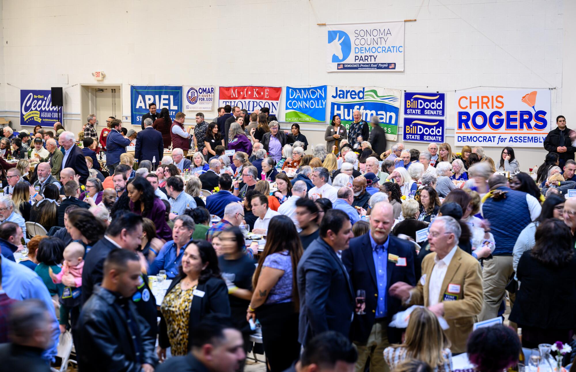 People mingle at an event. 